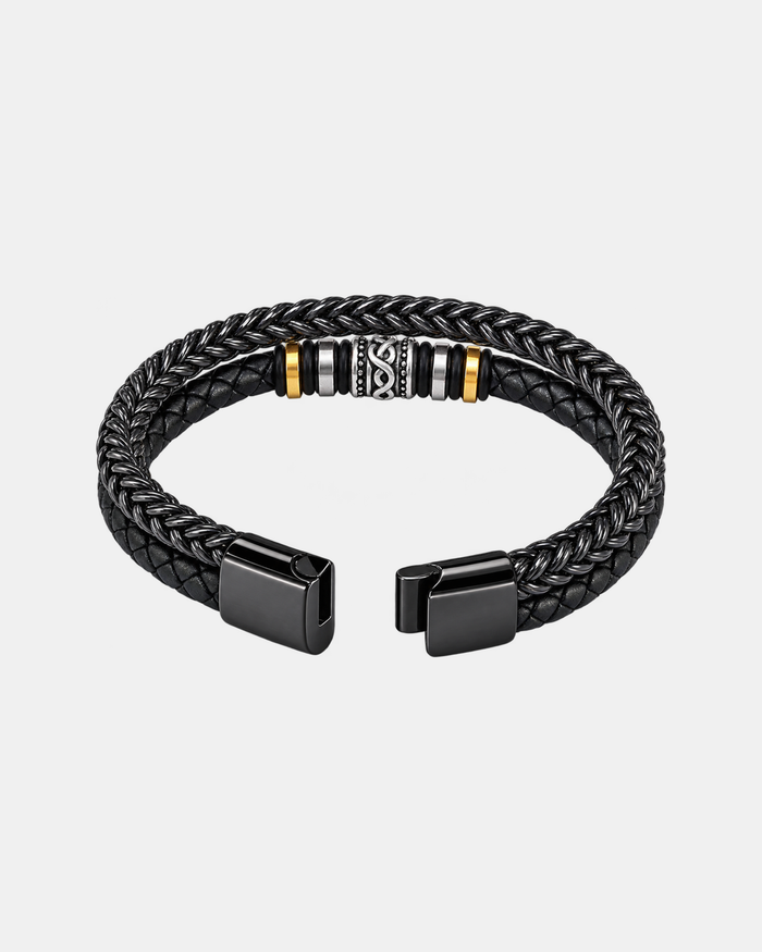 Braided bracelet in black on a light grey background