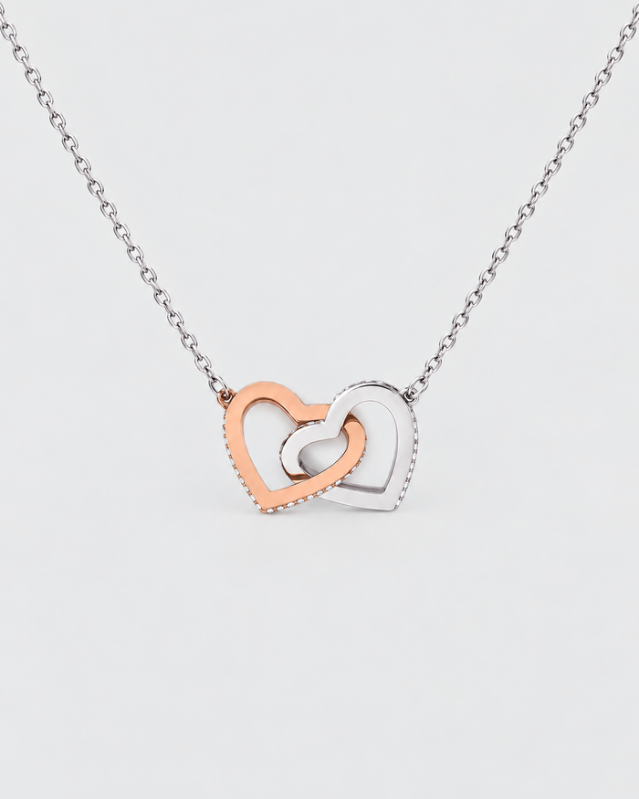 Connected Hearts necklace in silver-tone on a light grey background