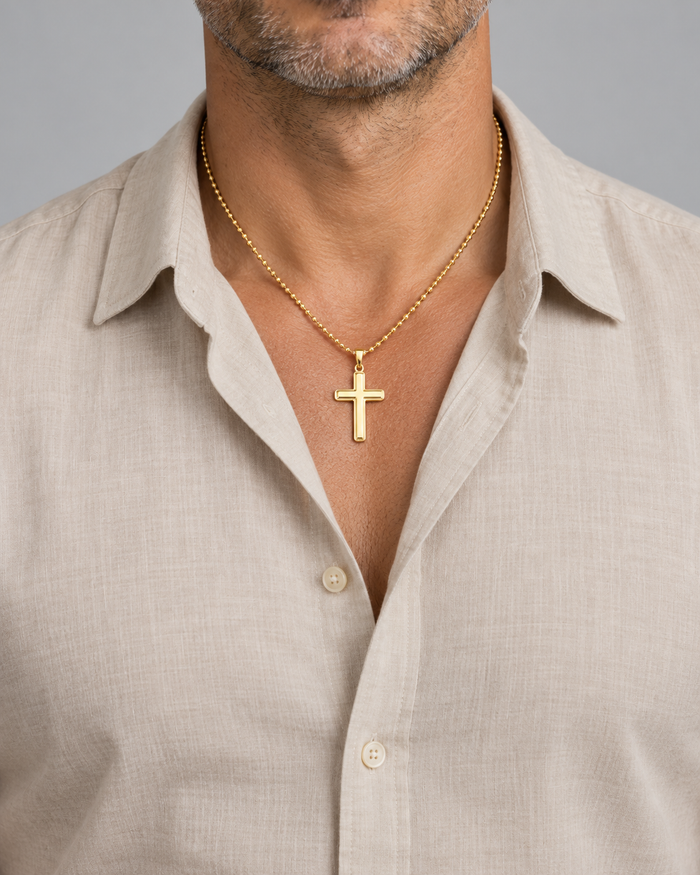 Man wearing the Cross necklace, gold-tone finish