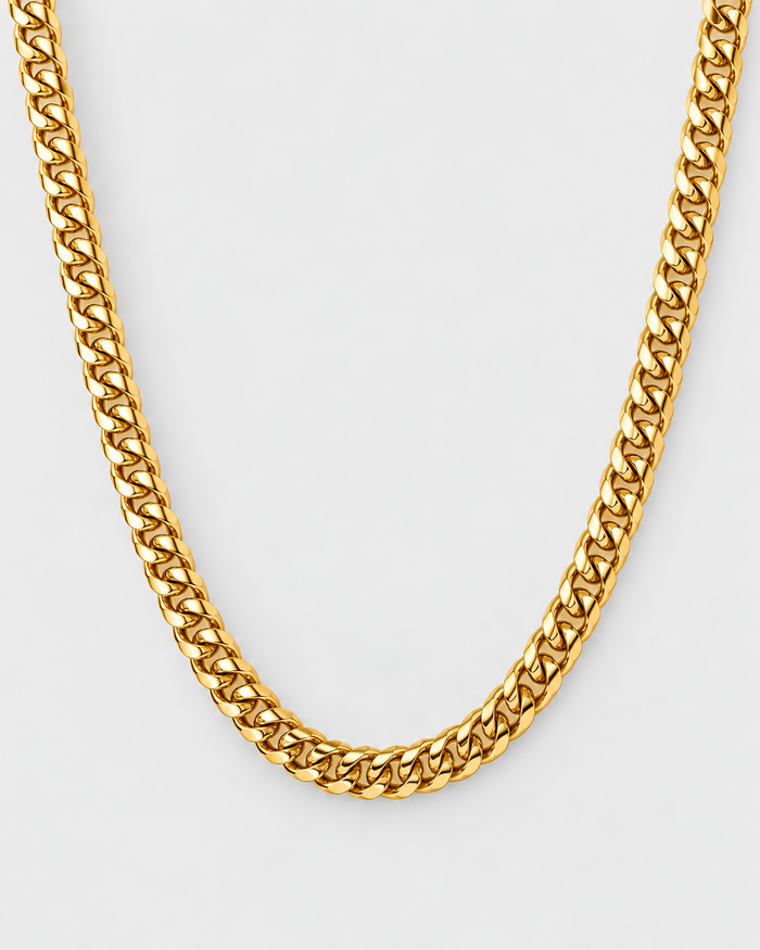 Cuban Chain necklace in gold-tone stainless steel on a light grey background