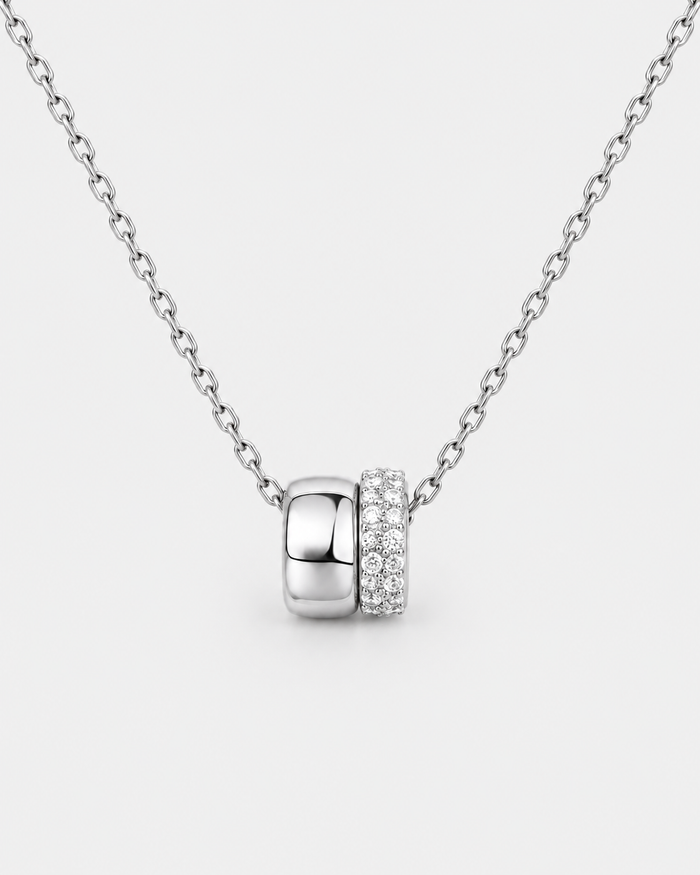 Eternal Rings necklace in silver-tone stainless steel on a light grey background