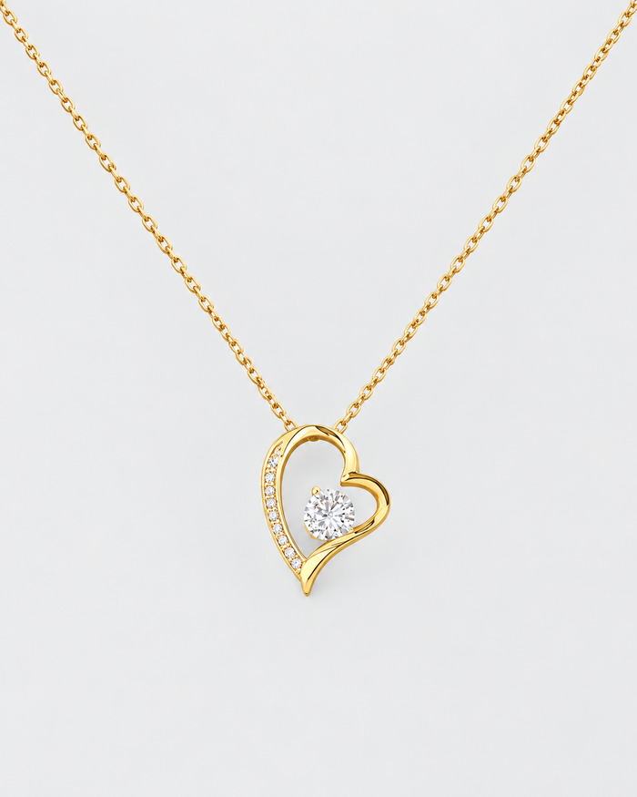 Forever Love necklace in gold-tone stainless steel on a light grey background