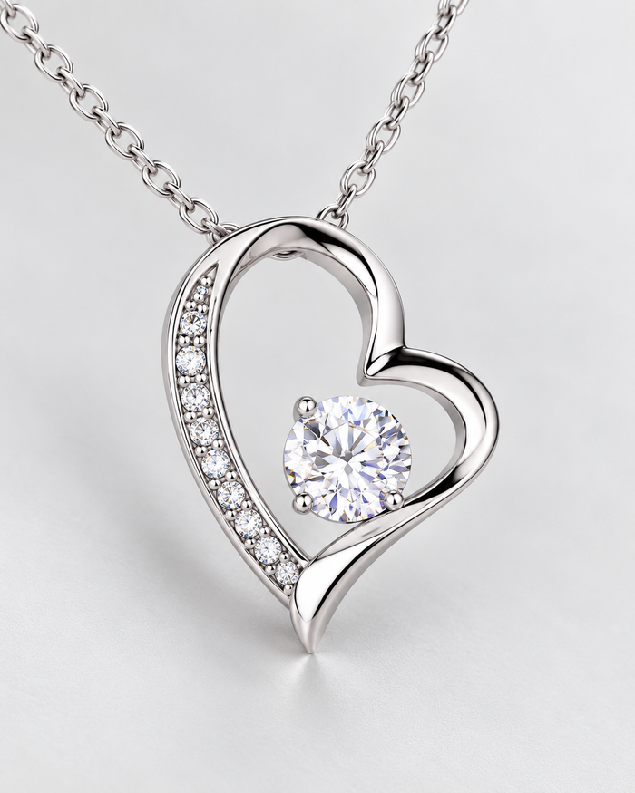 Close-up of the Forever Love necklace, silver-tone finish