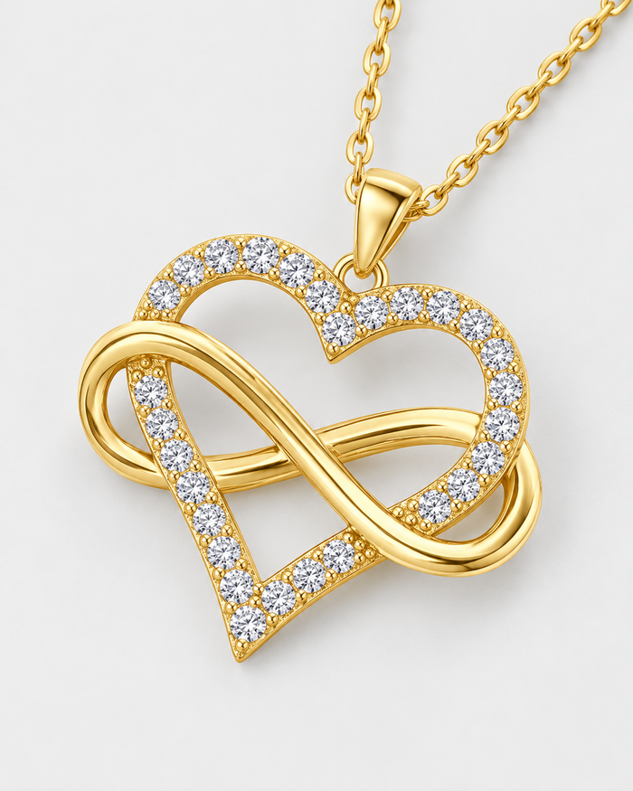 Close-up of the Infinity Heart pendant with sparkling zirconia stones, gold-tone finish