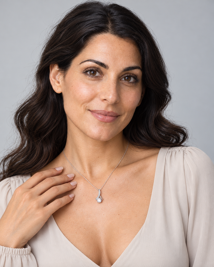 Woman wearing the Love Pendant necklace, silver-tone finish