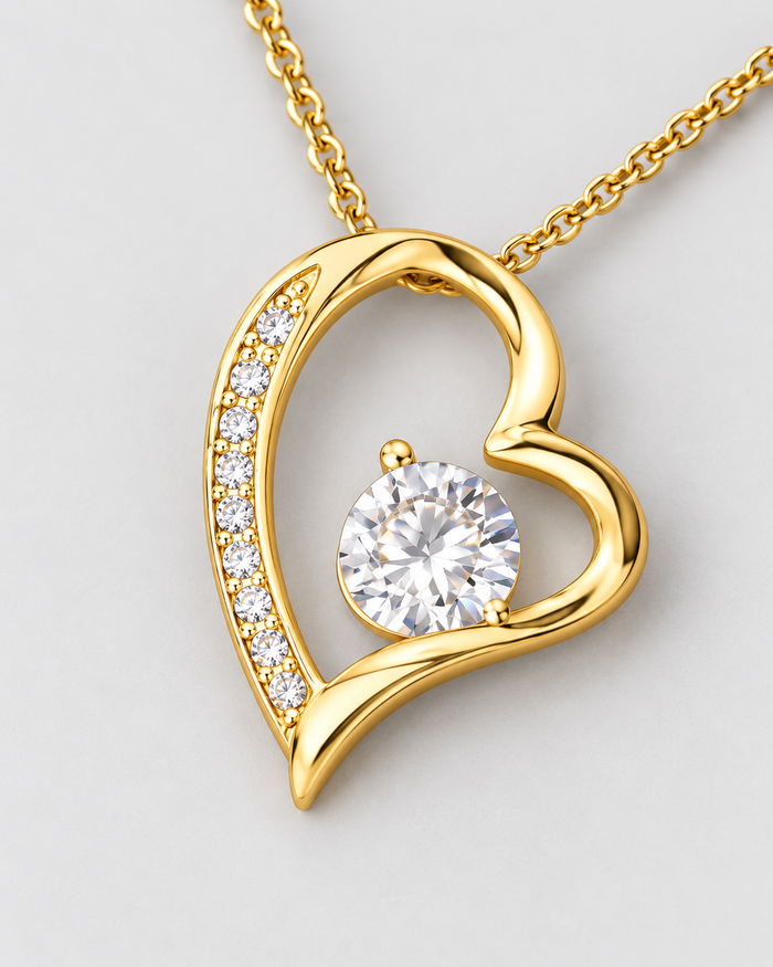 Close-up of the Always and Forever pendant with sparkling zirconia stones, gold-tone finish