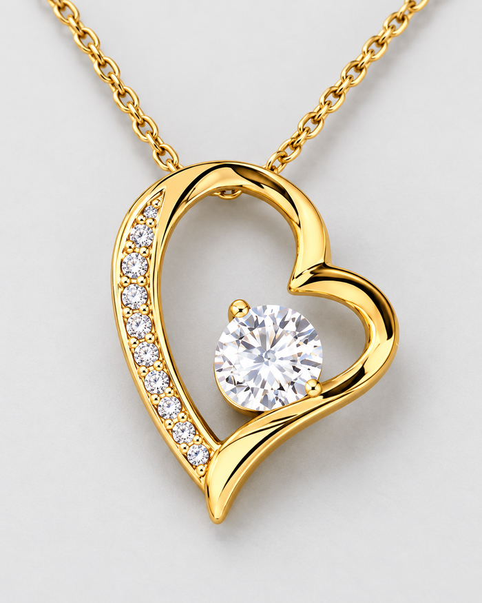 Close-up of the Forever Love pendant with sparkling zirconia stones, gold-tone finish
