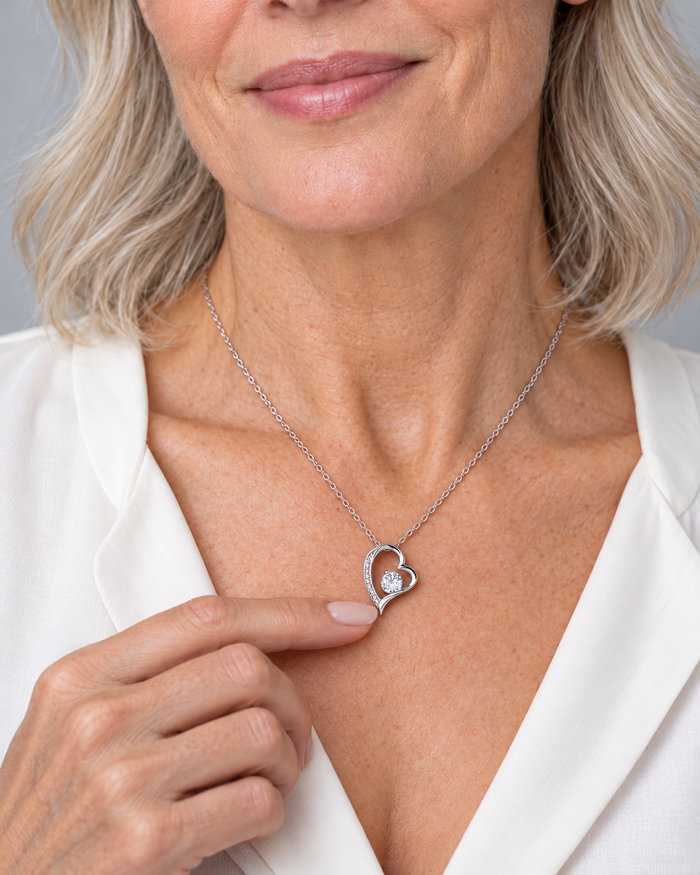 Woman wearing the Forever Love necklace, silver-tone finish