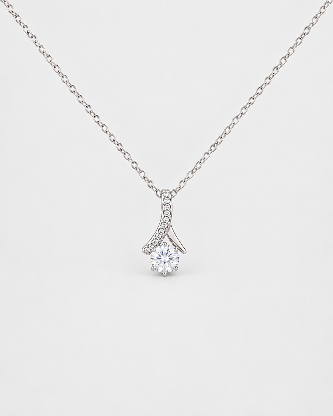 Love Pendant necklace in silver-tone stainless steel on a light grey background