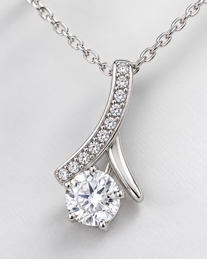 Close-up of the Love Pendant necklace with sparkling zirconia stones, silver-tone finish