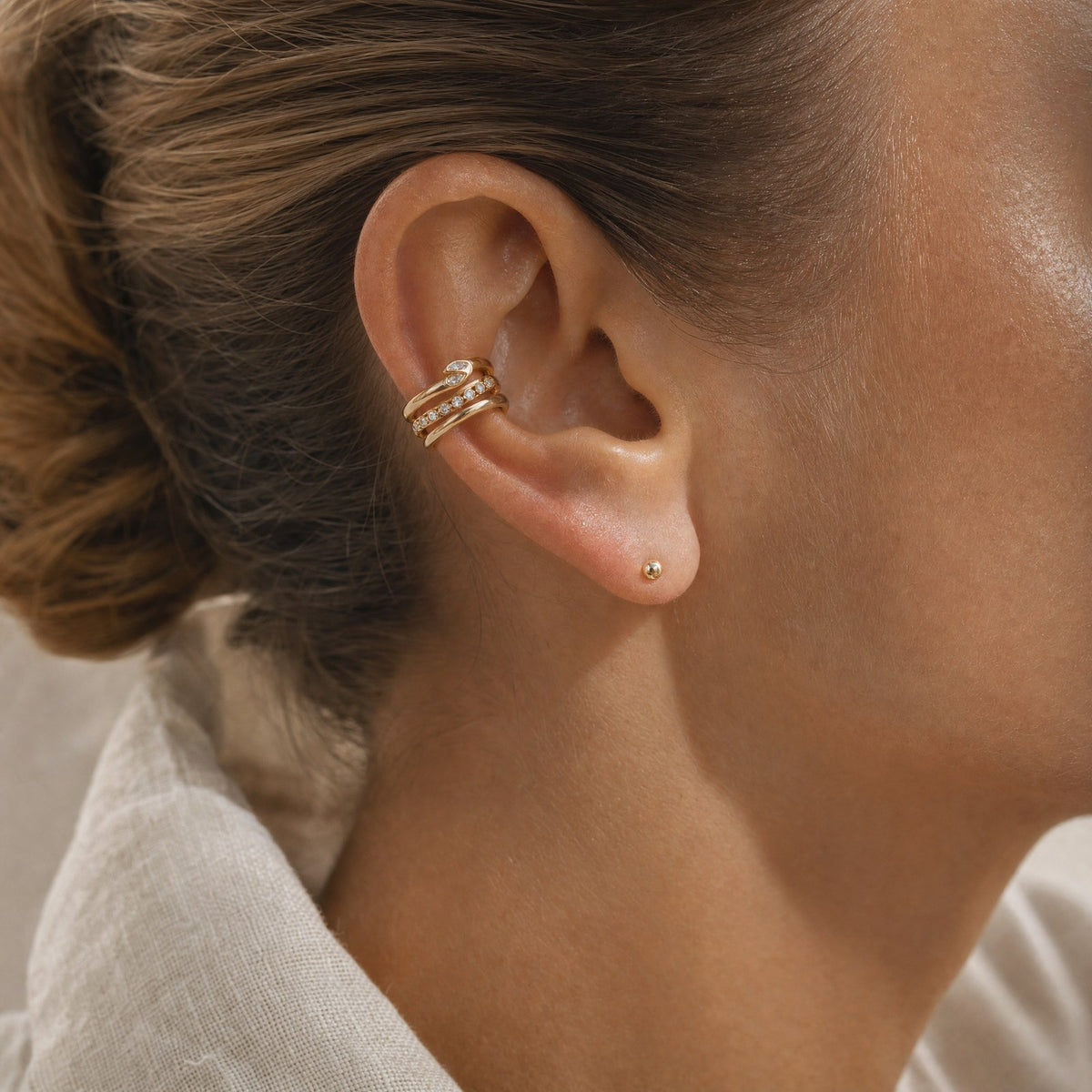 MAREA Lagoon Cuff gold ear cuff clipped on the upper ear